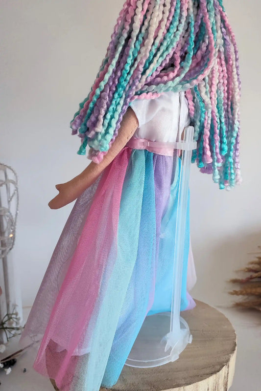 Peana para muñecas